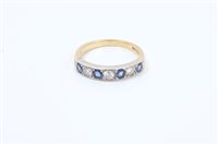 Lot 668 - Sapphire and diamond eternity ring, the half...