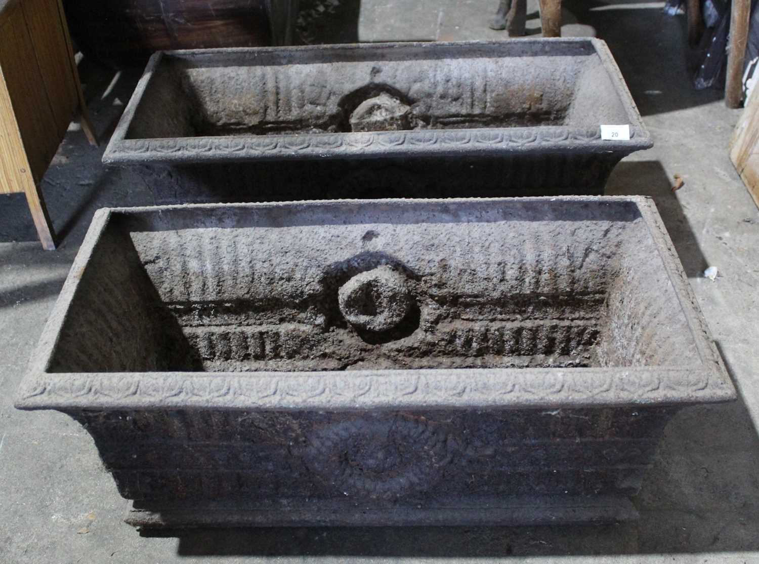 Lot 20 - Pair of Victorian cast iron planters, of trough form with flowerhead ornament, 74cm wide
