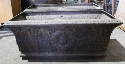 Lot 20 - Pair of Victorian cast iron planters, of trough form with flowerhead ornament, 74cm wide