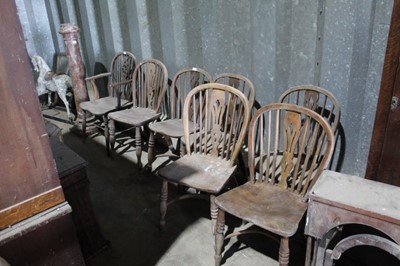 Lot 33 - Six 19th century elm Windsor hoop back kitchen chairs with crinoline stretchers and Windsor elbow chair on turned legs (6)