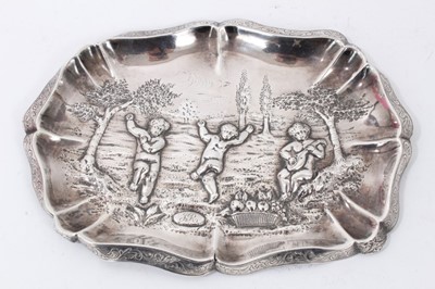 Lot 266 - Victorian silver pin dish with embossed dancing putti decoration
