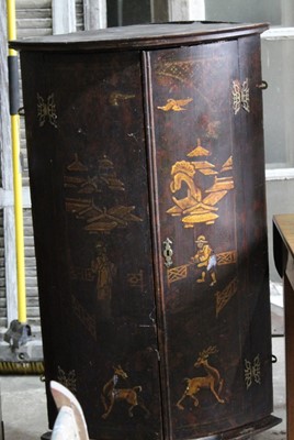 Lot 68 - 18th century black lacquered bowfront corner cupboard