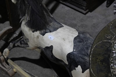 Lot 50 - Old painted pine rocking horse with black hair mane and tail - sub frame lacking, approx 100 cm long