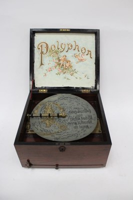 Lot 2376 - Polyphon table model 19th Century, with 21 11" discs, some loss of veneer, weak arm spring