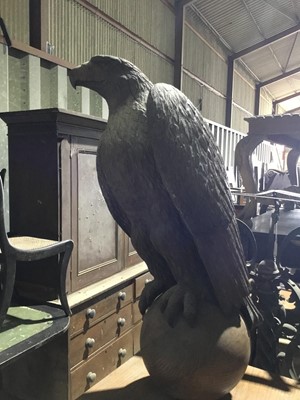 Lot 92 - Finely carved oak eagle, raised on orb and mounted on a wooden box plinth, total height 101cm high