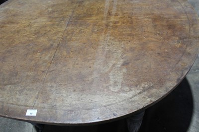 Lot 88 - Unusual Victorian burr elm veneered centre table, with oval top raised on reeded tapered legs and castors, 125 x 50cm