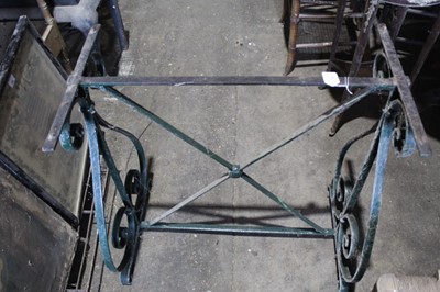 Lot 78 - Old wrought iron garden table base with scroll ends joined by X framed stretchers 74 cm wide, 73 cm high
