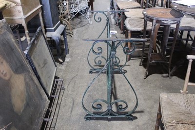 Lot 78 - Old wrought iron garden table base with scroll ends joined by X framed stretchers 74 cm wide, 73 cm high
