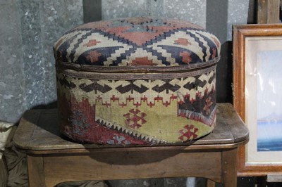 Lot 102 - Tekke ottoman footstool, of oval form, 58cm wide, together with a brass `fender