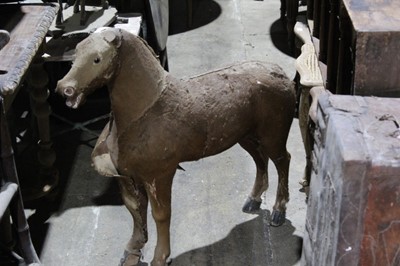 Lot 117 - Large antique carved wooden horse, with hide covering and glass eyes, 90cm long