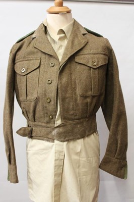 Lot 786 - 1950's British Military 1949 pattern battledress blouse, dated 1955, with Home Guard rank insignia and badges, together with a Post War Great Coat and a 1949 pattern battledress blouse and trousers...