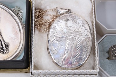 Lot 231 - Large oval silver locket on chain, large oval silver angel pendant on chain, silver gilt seahorse pendant, silver mounted nut pendant on chain, silver amber brooch and three rings