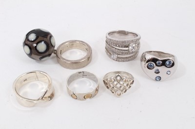 Lot 235 - Yves Saint Laurent silver heart shaped ring, together with five other silver rings (6)