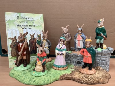 Lot 1296 - Royal Doulton Bunnykins Robin Hood Collection comprising Little John, Robin Hood, Friar Tuck, Will Scarlett, Sheriff Of Nottingham, King Richard, Maid Marion and Prince John, all boxed, together wi...