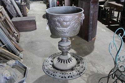 Lot 162 - Impressive large late 19th century Dutch brass planter with lions ring handles and embossed flowers on ornate base with pierced decoration 98 cm high. The planter 55 cm diameter.