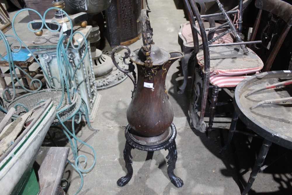 Lot 129 - Cast iron urn stand, together with a highly unusual toleware urn of large size, possibly an advertising piece, signed to underside Henry Loveridge, Merridale Works, Wolverhampton, ewer 63cm high