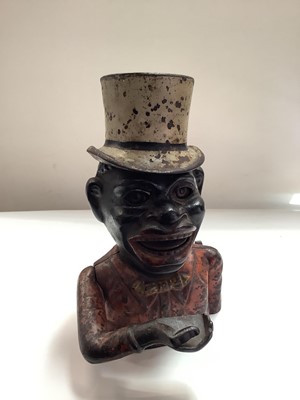 Lot 2708 - Late 19th/early 20th century cast iron “Gentleman in Top Hat” mechanical money bank in distressed original paint finish, with moveable arm, tongue and eyes worked by a lever and patent date March 1...