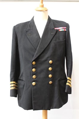 Lot 790 - 1960's Royal Navy Commander's Service Dress jacket with mounted medal ribbons, together with another similar, a Royal Navy Mess Dress jacket and other Naval uniform (6)