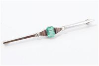 Lot 705 - Art Deco emerald and diamond three stone bar...