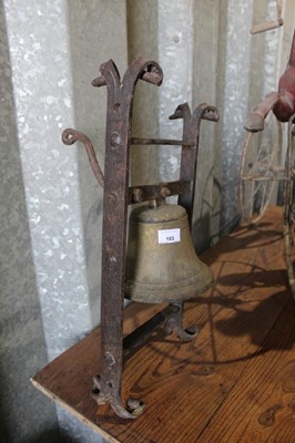 Lot 183 - Antique wall mounted bell, with wrought iron frame, 57cm high