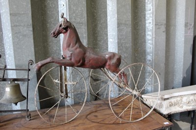 Lot 185 - Rare late 19th / early 20th century painted tin childs ride on horse tricycle, approximately 93cm long