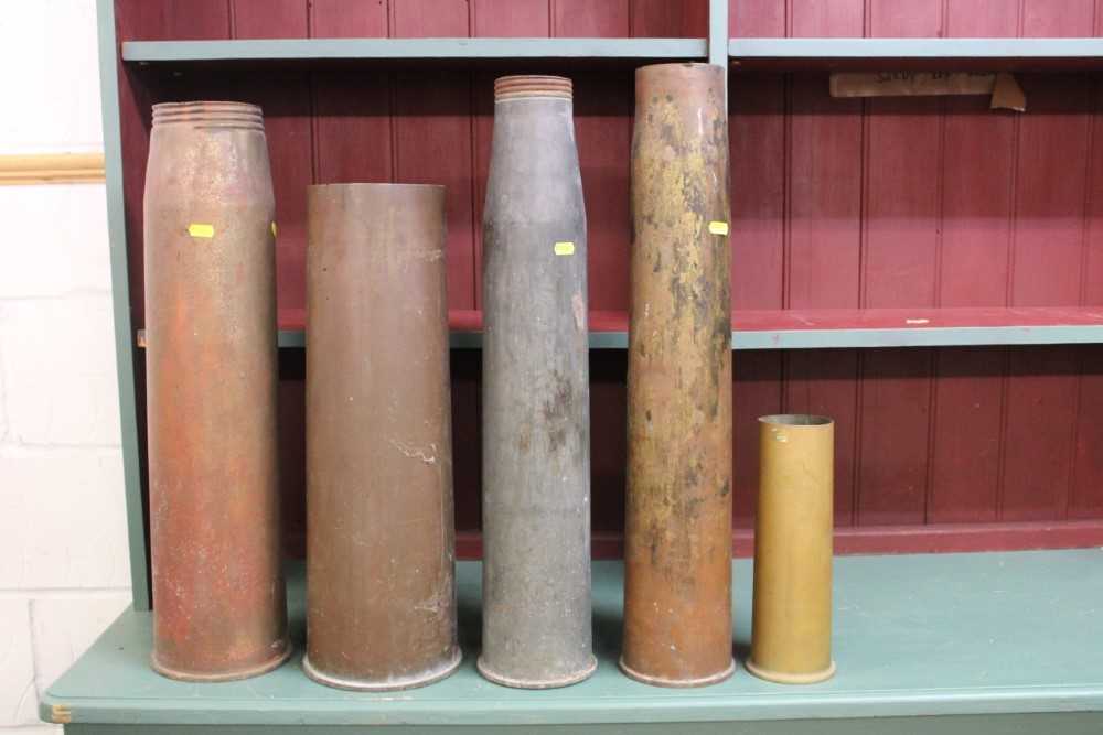 Lot 806 - Collection of seven military shell carriers, together with five shell cases (1 box)