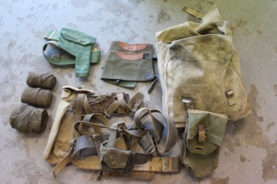 Lot 810 - Large collection of Second World War canvas webbing items to include pouches, holsters and belts (1 box)