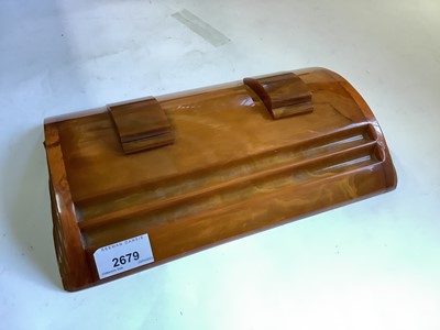 Lot 2679 - Art Deco phenolic amber Bakelite desk/inkstand