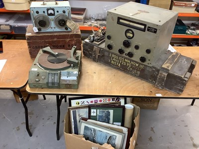 Lot 818 - Group of assorted militaria to include two field radios / radio recievers, a collection of military pictures and prints, a wooden ammunition box, Torpedo work box and other items