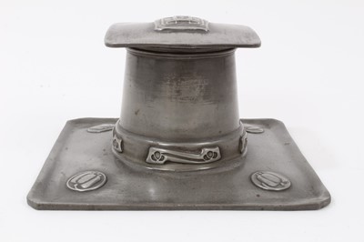 Lot 2676 - A Liberty Tudric Pewter inkwell designed by Archibald Knox, model no.0141, square section tray with tapering drum well and hinged square section cover, cast in low relief with foliate panels, with...