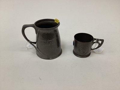 Lot 2674 - Art Nouveau Liberty Tudric pewter mug designed by Archibald Knox, applied with golfing motif, the glazed base etched '19th hole', model 066, together with an Art Nouveau Liberty Tudric pewter mug d...