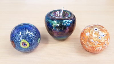 Lot 1042 - Three large paperweights, comprising two Murano and one Heron Apple (3)