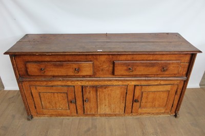 Lot 1043 - Early 18th century elm dresser base with two drawers and cupboards 
below