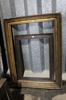 Lot 213 - Large 19th century gilt gesso picture frame, aperture approximately 120 x 82cm, together with a smaller oak frame