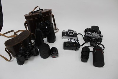 Lot 2468 - Group of cameras, lenses and accessories, including a Pentax Spotmatic II, Pentax SP 500, Praktica MTL 5B, Praktisix, and two pairs of binoculars