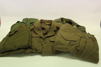 Lot 740 - 1960's British military 1949 pattern battledress blouse, dated 1960, together with another battledress blouse, dated 1965, two pairs of trousers and a pair of overalls (5)