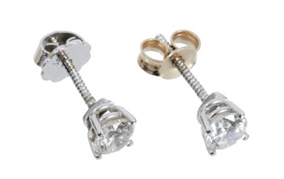 Lot 443 - Pair of diamond single stone earrings