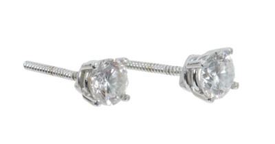 Lot 443 - Pair of diamond single stone earrings