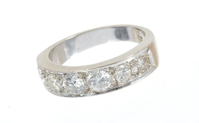 Lot 445 - Diamond half hoop ring with six graduated brilliant cut diamonds