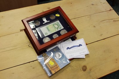 Lot 670 - G.B. Danbury Mint six coin base metal Elizabeth II '90th Birthday' commemorative set (with £1 banknote) and Royal Mint issued silver 'Big Ben' £100 coin 2015 in glass topped wood cabinet with Cert...