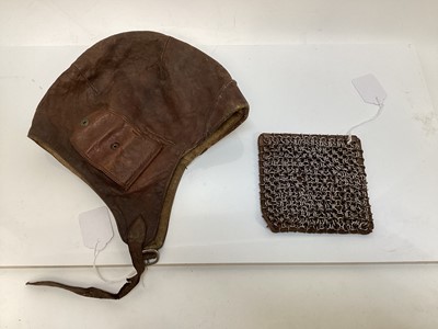 Lot 2108 - Vintage Brown leather flying / motorcycle helmet, with press studs stamped- made in Czechoslovakia, together with a chain mail panel (2)