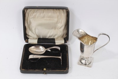 Lot 336 - Georgian style silver cream jug, together with silver spoon and pusher in fitted case