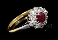 Lot 732 - Ruby and diamond cluster ring, the flower-head...