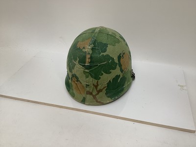 Lot 765 - American Vietnam era M1 steel helmet, complete with camo cover, liner and chinstrap, the cover with graffiti 'Khe Sanh 68, Semper FI, Charlie 13 kills'.