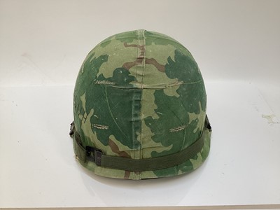 Lot 765 - American Vietnam era M1 steel helmet, complete with camo cover, liner and chinstrap, the cover with graffiti 'Khe Sanh 68, Semper FI, Charlie 13 kills'.