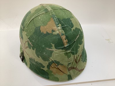 Lot 765 - American Vietnam era M1 steel helmet, complete with camo cover, liner and chinstrap, the cover with graffiti 'Khe Sanh 68, Semper FI, Charlie 13 kills'.