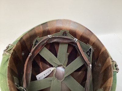 Lot 765 - American Vietnam era M1 steel helmet, complete with camo cover, liner and chinstrap, the cover with graffiti 'Khe Sanh 68, Semper FI, Charlie 13 kills'.