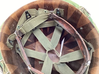 Lot 765 - American Vietnam era M1 steel helmet, complete with camo cover, liner and chinstrap, the cover with graffiti 'Khe Sanh 68, Semper FI, Charlie 13 kills'.