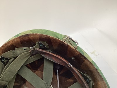 Lot 765 - American Vietnam era M1 steel helmet, complete with camo cover, liner and chinstrap, the cover with graffiti 'Khe Sanh 68, Semper FI, Charlie 13 kills'.