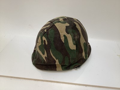 Lot 775 - American M1 steel helmet complete with liner, chinstrap and South Vietnamese camouflage cover, used by the Army of the Republic of Vietnam (ARVN) in support of US troops.